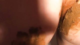 Naked girl smearing crap on her perfect body