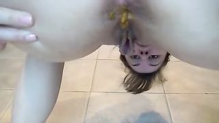 Smoking Ariel shitting on hte kitchen floor