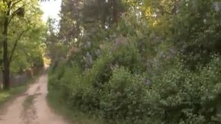 Brunette teen undressed to poop behind a cabain