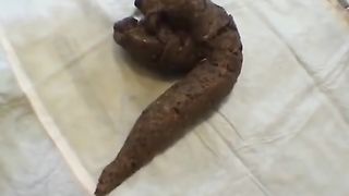 Young woman playing with her own shit