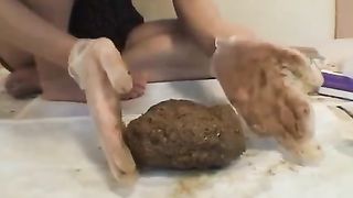 Young woman playing with her own shit