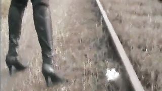 Sexy woman pooping on a rail