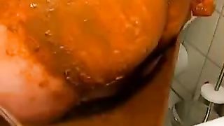 Rubbing fresh shit on her naked body