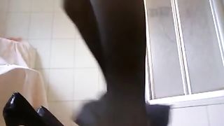 Skinny girl shitting on black high heels