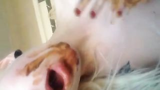 Blonde college girl rubbing poop on her face
