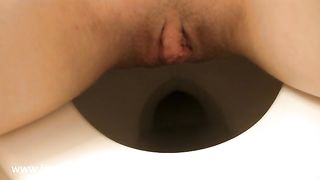 Shaved girl dropped a long turd in close up
