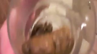 Sexy blonde babe pooping in a glass