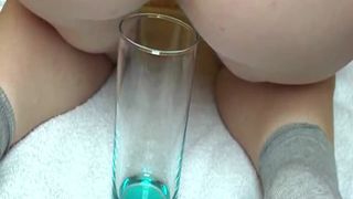 Horny girlfriend pooping in a Pepsi glass