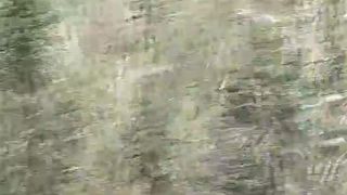 Shaved MILF pooping a hard turd on the grass