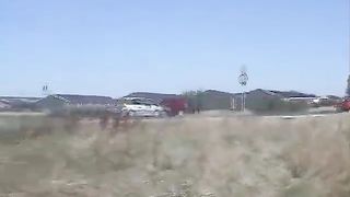 Shaved MILF pooping a hard turd on the grass