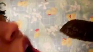 Young girl sucking a long brown turd