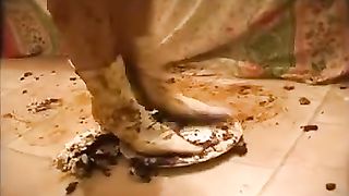 Nude girl masturbating with poop from a plate