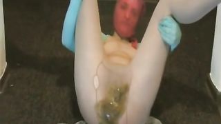 Young girl wearing a mask while shitting in pantyhose