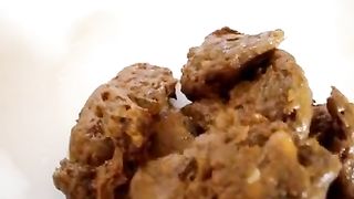 Fat girl pooping on a white plate for dinner