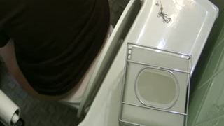 Young girl caught pooping in a public bathroom