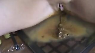 Sexy teen pooping on a glass table