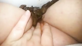 BBW girl smearing shit on her shaved pussy