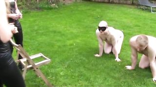 Two sexy mistresses feeding their slaves