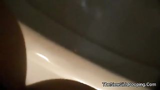 Skinny brunette shitting in a lunch box