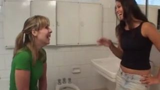 Two sexy girls eating poop from a toilet