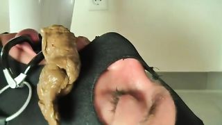 Beautiful brunette shitting on her masked boyfriend