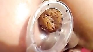 Thai brunette cam girl shitting in close up