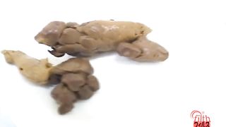 Japanese girl cuts her long turd with a knife