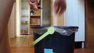 Tattooed girl pooping in a black trash can
