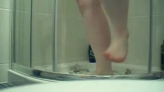 Busty teen smearing crap on her tits