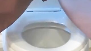 Tattooed girl pooping a lot in reverse position