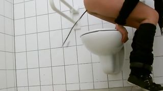 Sexy babe did a real mess in a public bathroom