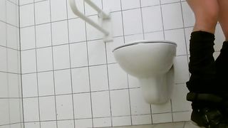 Sexy babe did a real mess in a public bathroom