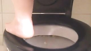 Yellow shit over toilet while she records everything in close u