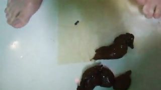 Beautiful young girl shitting in the bathtub