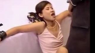 Mature man pooping on tied Japanese teen