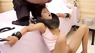 Mature man pooping on tied Japanese teen