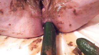 Chubby busty brunette babe masturbating with long cucumber