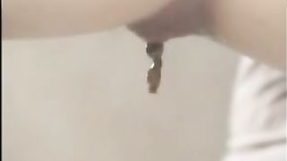 Beautiful constipated girl shitting a big one