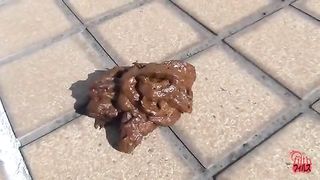 Blindfolded sexy Japanese pooping on a roof