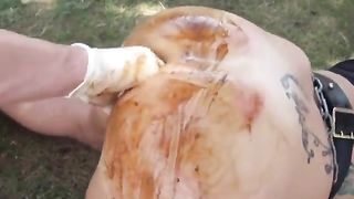 Fisting a chubby slut hard outdoor