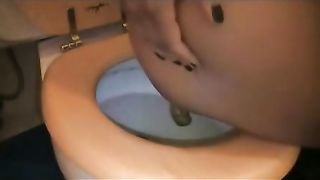 Ebony teen holding her tits while pooping