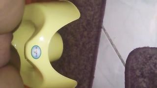 Shaved girl pooping in a yellow potty