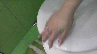Blonde babe shitting in a white potty