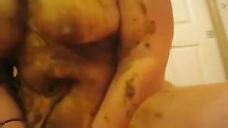Fat wife rubbing shit on her body