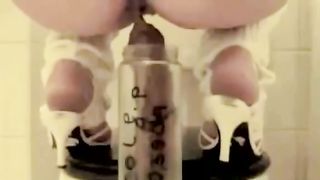 Long turd in glass jar