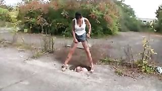 Sexy teen shitting on her male slave in public