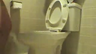 Muscular teen pooping in reverse position