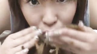 Horny Asian teen eating a big long turd
