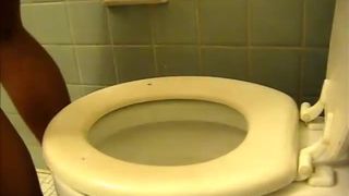Mexican girl pooping over toilet
