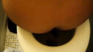 Mexican girl pooping over toilet